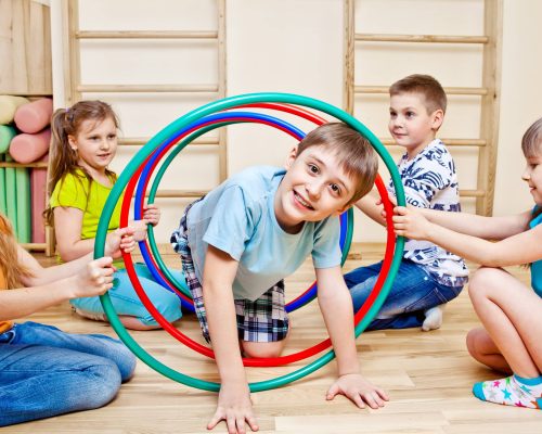 Children playing in school gym