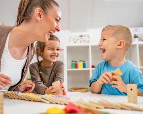 Teacher with children in a Kindergarten Classroom. Healthy learn
